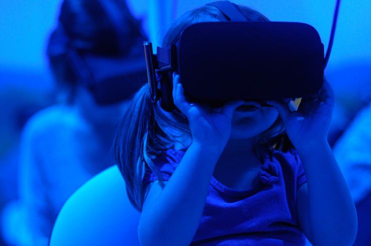 girl using VR goggles